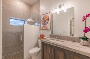 a bathroom with a toilet and a sink and a shower at Paradise Retreat at Copper Rock! in Hurricane +35 photos