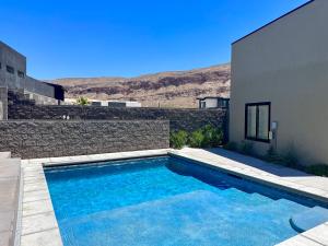 a swimming pool in the backyard of a house at Paradise Retreat at Copper Rock! in Hurricane