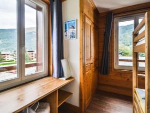 a room with a window and a desk with a view at Appartement Morzine, 3 pièces, 6 personnes - FR-1-684-65 in Morzine