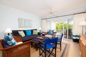A seating area at Jamaica Time Driftwood at Sea Palms 3BR 3BA Condo in Ocho Rios with Pool and Beach Front with Views ONLY 10 Mins from Ochi Intl Airport Direct flight from Miami