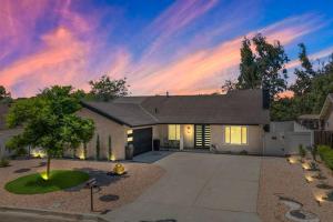 a house with a sunset in the background at Vineyard Chic Oasis: Modern Elegance near Temecula Wineries in Temecula