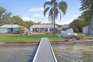 a house with a bridge over a body of water at Boat Harbour Haven in Bonnells Bay