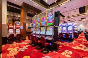 a casino with a bunch of slot machines at Vinash Luxury Suite in Edmonton