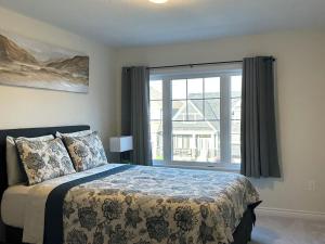 Voodi või voodid majutusasutuse Spacious,comfy house,less than 15 mins to Niagara Falls toas