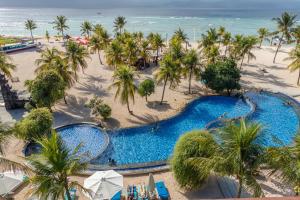 an aerial view of a resort pool and the beach at Mahagiri Resort Nusa Lembongan in Nusa Lembongan