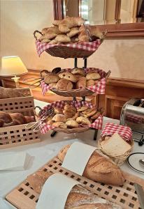 a bunch of loaves of bread on a table at Hotel Mirabeau, BW Signature Collection, Lausanne in Lausanne