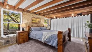 Postel nebo postele na pokoji v ubytování Granite Cottage