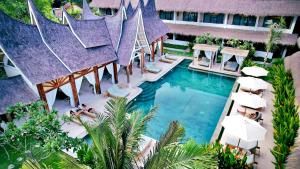 an aerial view of a resort with a swimming pool at Rascals Hotel - Adults Only in Kuta Lombok