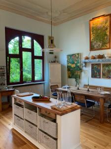 a kitchen with a table with wine glasses on it at Altbauwohnung in Gründerzeitvilla in Wuppertal