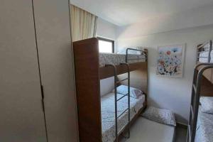 En eller flere senge i et værelse på Residencial Taormina - apartamento à beira-mar novinho! + 37 billeder