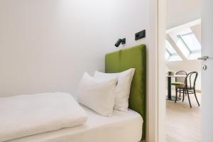 Voodi või voodid majutusasutuse Bio-Hotel Schani Wienblick toas
