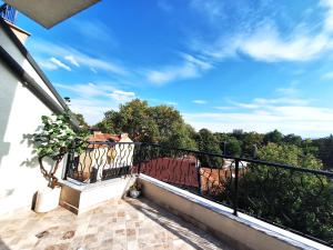 a balcony with a view of trees and the sky at Cloud 6 -Top Center,360° view,Free private parking in Plovdiv