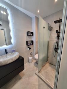 a bathroom with a shower and a sink and a toilet at Cloud 6 -Top Center,360° view,Free private parking in Plovdiv