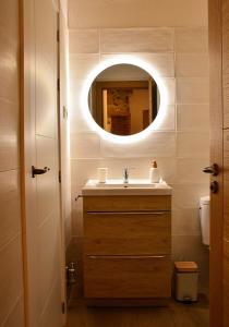 a bathroom with a sink and a mirror at El Molino de Nocedo in León