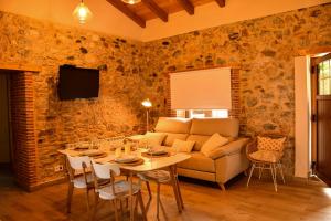 a living room with a couch and a table at El Molino de Nocedo in León