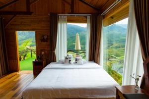 En eller flere senge i et værelse på O Châu Homestay Lào Cai