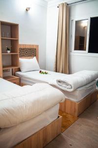 מיטה או מיטות בחדר ב-PLAYA HOTEL