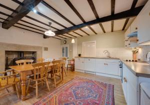 a kitchen and dining room with a table and chairs at Lyncroft in Aysgarth