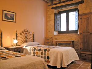Posteľ alebo postele v izbe v ubytovaní Las Casas del Duraton