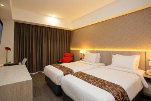 Postel nebo postele na pokoji v ubytování Avissa Suites