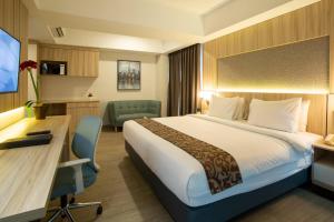 Postel nebo postele na pokoji v ubytování Avissa Suites