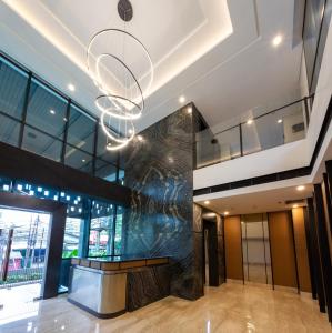 a view of the lobby of a building with a sculpture at Avissa Suites in Jakarta