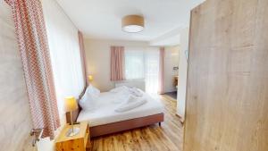 Łóżko lub łóżka w pokoju w obiekcie Pitztal Living Apartments