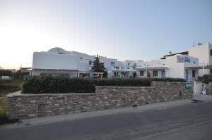 a brick retaining wall on the side of a street at ThalaSEA - village Antiparos in Antiparos