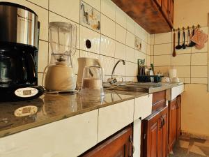 a kitchen with a blender on a counter at RESIDENCE DORANA in Kribi