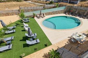 The swimming pool at or close to Luxury Suites in Stavromenos