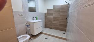 a bathroom with a toilet and a sink and a shower at Amrots Deghceni - Boutique Castle Stay in Dilijan +82 photos