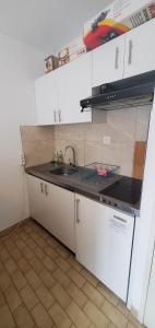 a kitchen with a sink and a counter top at Appartement T2 30m2 Vielle Aure in Vielle-Aure