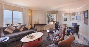 a living room with a couch and a table at Southern Sun Maputo in Maputo