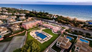 an aerial view of a resort and the ocean at Vila Gale Collection Praia in Albufeira