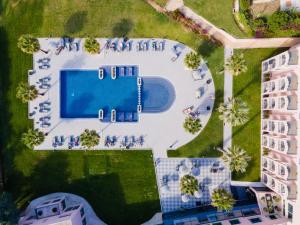 an overhead view of a swimming pool in a yard at Vila Gale Collection Praia in Albufeira