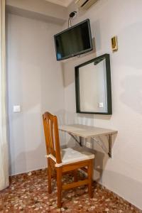 TV a/nebo společenská místnost v ubytování L'Oncle Pere Habitacions + 20 fotografií