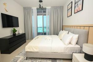 Postel nebo postele na pokoji v ubytování Ace 1BR-Apartment in Al reem