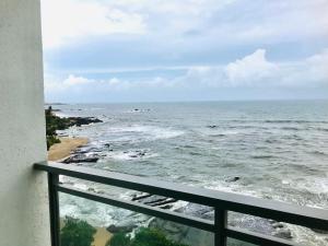a view of the ocean from a balcony at Oceanfront Condos Galle-Apartment L410 A in Galle
