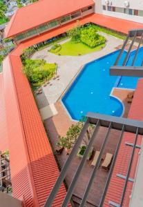 an overhead view of a building with a swimming pool at Oceanfront Condos Galle-Apartment L410 A in Galle