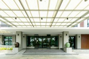 an office building with a wooden ceiling at Farthai Residence in Phan Thong