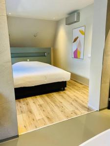Postel nebo postele na pokoji v ubytování Luxe vakantievilla 'Sieta' op Ameland met wellness