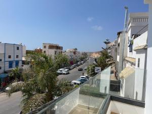 a balcony with a view of a city street at La Perle Taghazout apparts 2-3px in Taghazout