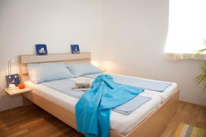 Postel nebo postele na pokoji v ubytování Apartment Adriana