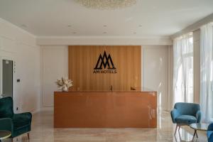 a podium in a room with aania sign on the wall at AM HOTEL WELLNESS **** in Rimavská Sobota +39 photos