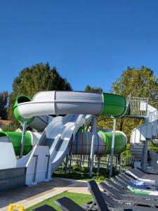a water slide at a water park at Camping Riva Bella - Mobil home Les4L in Ouistreham