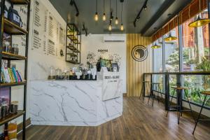 a bar with a marble counter in a room at Twin Hotel in Kampot