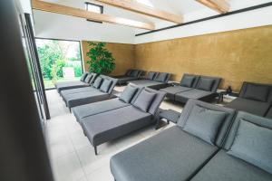 a waiting room with couches and chairs at Vila Vita Pannonia in Pamhagen