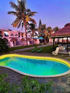 a swimming pool in front of a resort at Stella Rina in Grand Baie