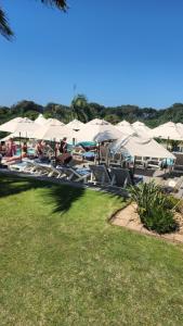 a group of lounge chairs and umbrellas at Umhlanga Breakers Resort in Durban