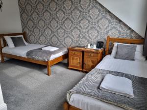 Postel nebo postele na pokoji v ubytování Fellview Guest House